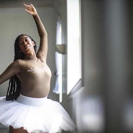 A portrait of Chanel Holland dancing in her ballet studio