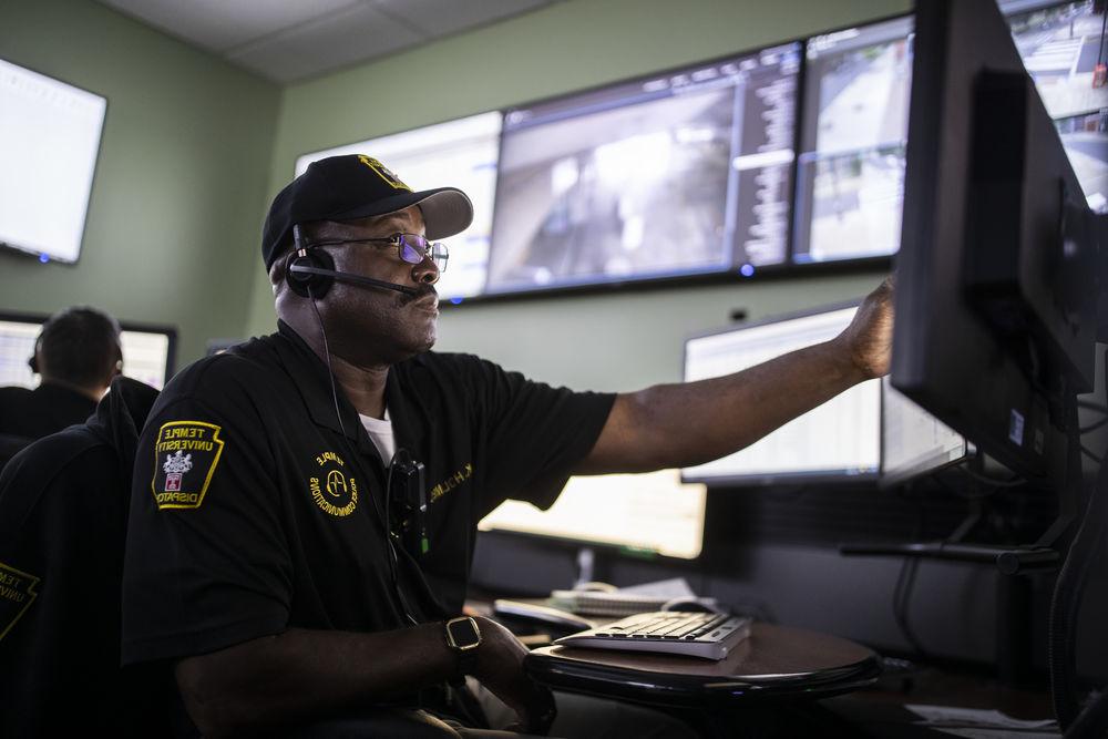 one of Temple's security staff checking safety camera footage.