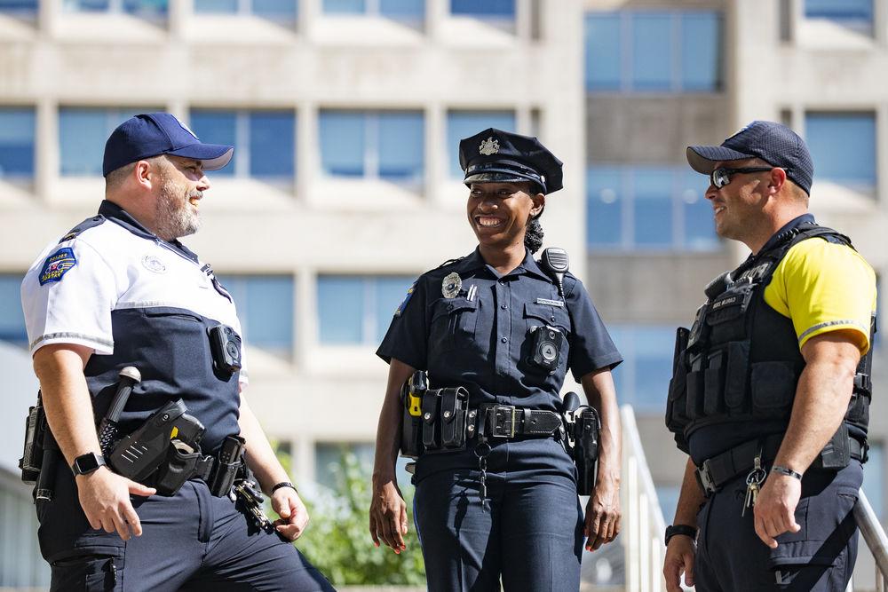 three Temple safety professionals talking.